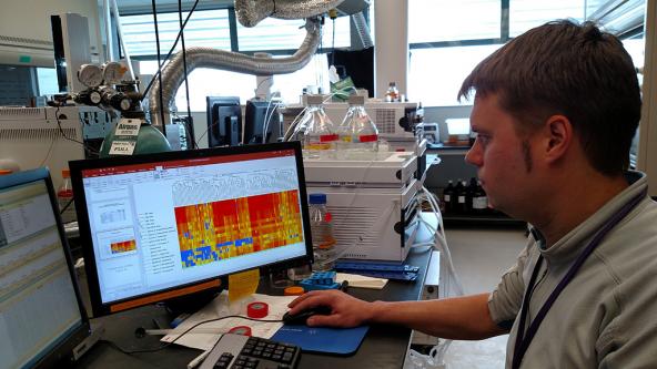 Dr. Ed Kolodziej analyzes mass spectrometry data in his lab at the Center for Urban Waters. Photo: Kris Symer